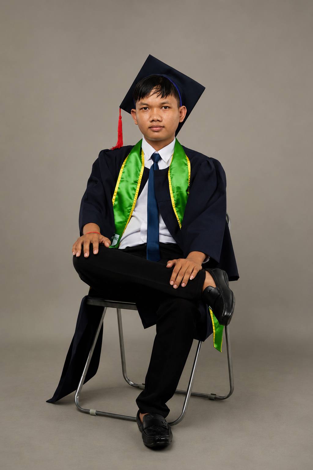 HIN CHEU in graduation attire